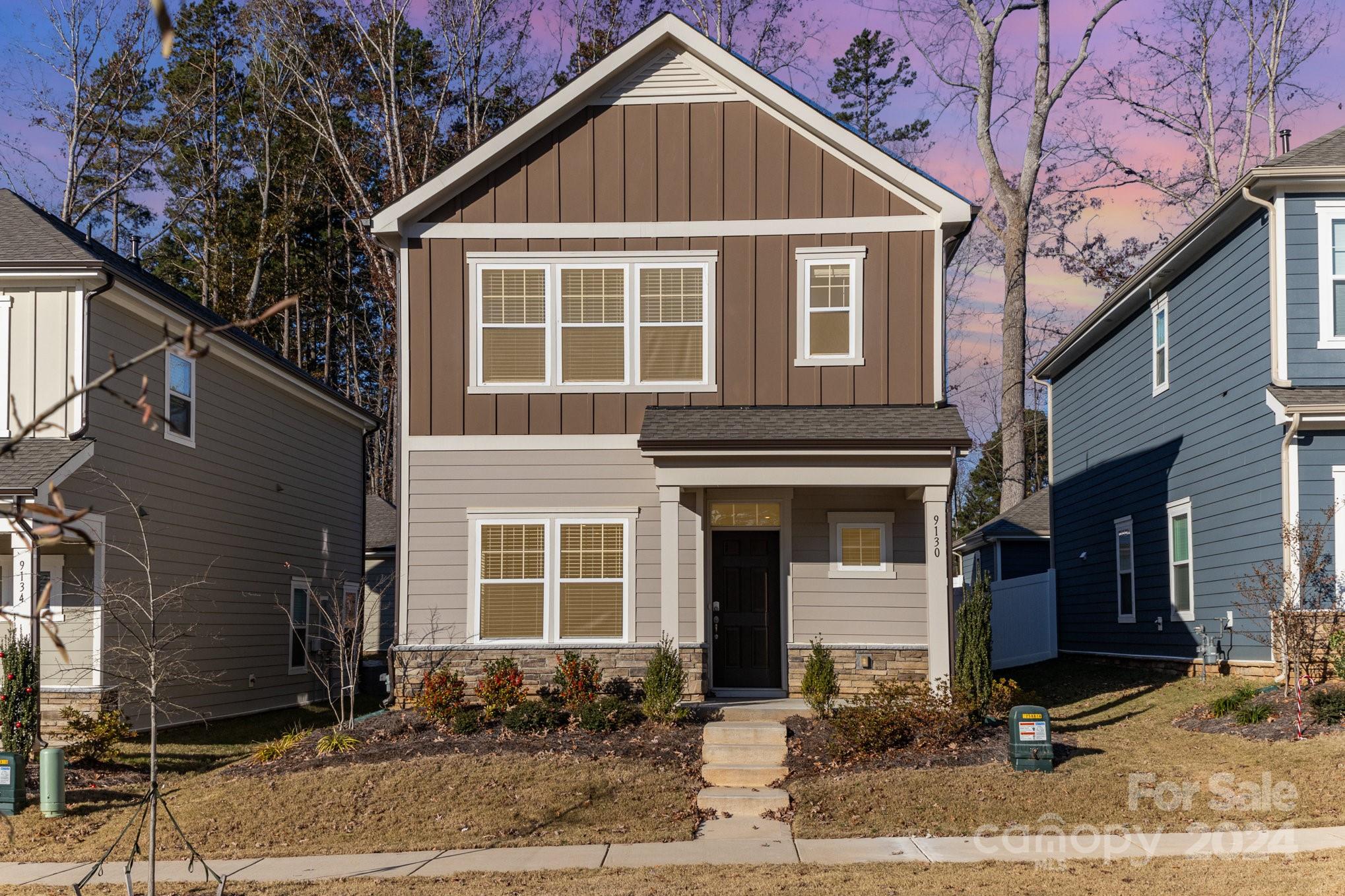 a front view of a house with a yard