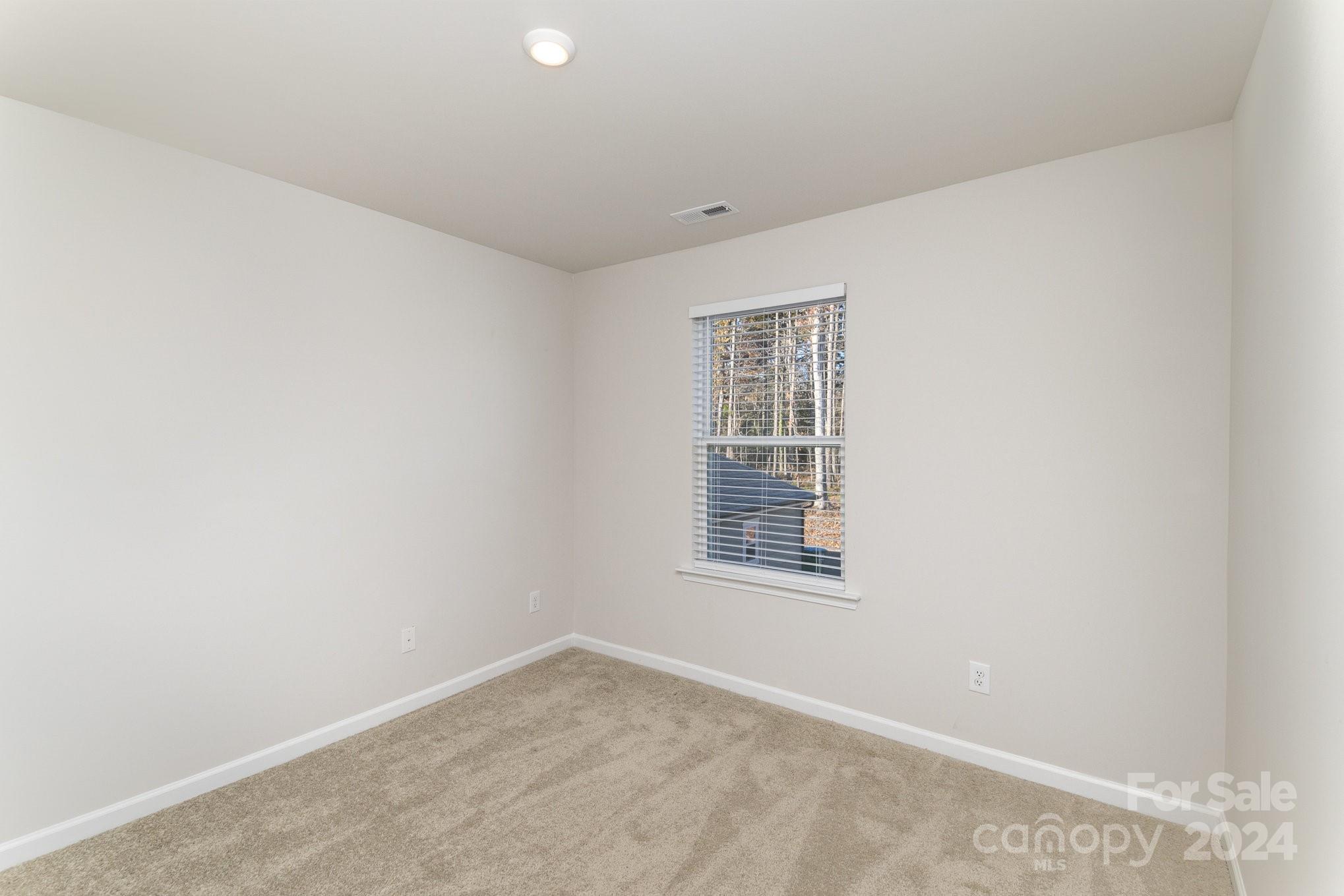 9130 Ramsford Road Charlotte, NC 28227 - Photo 12 of 18 an empty room with windows