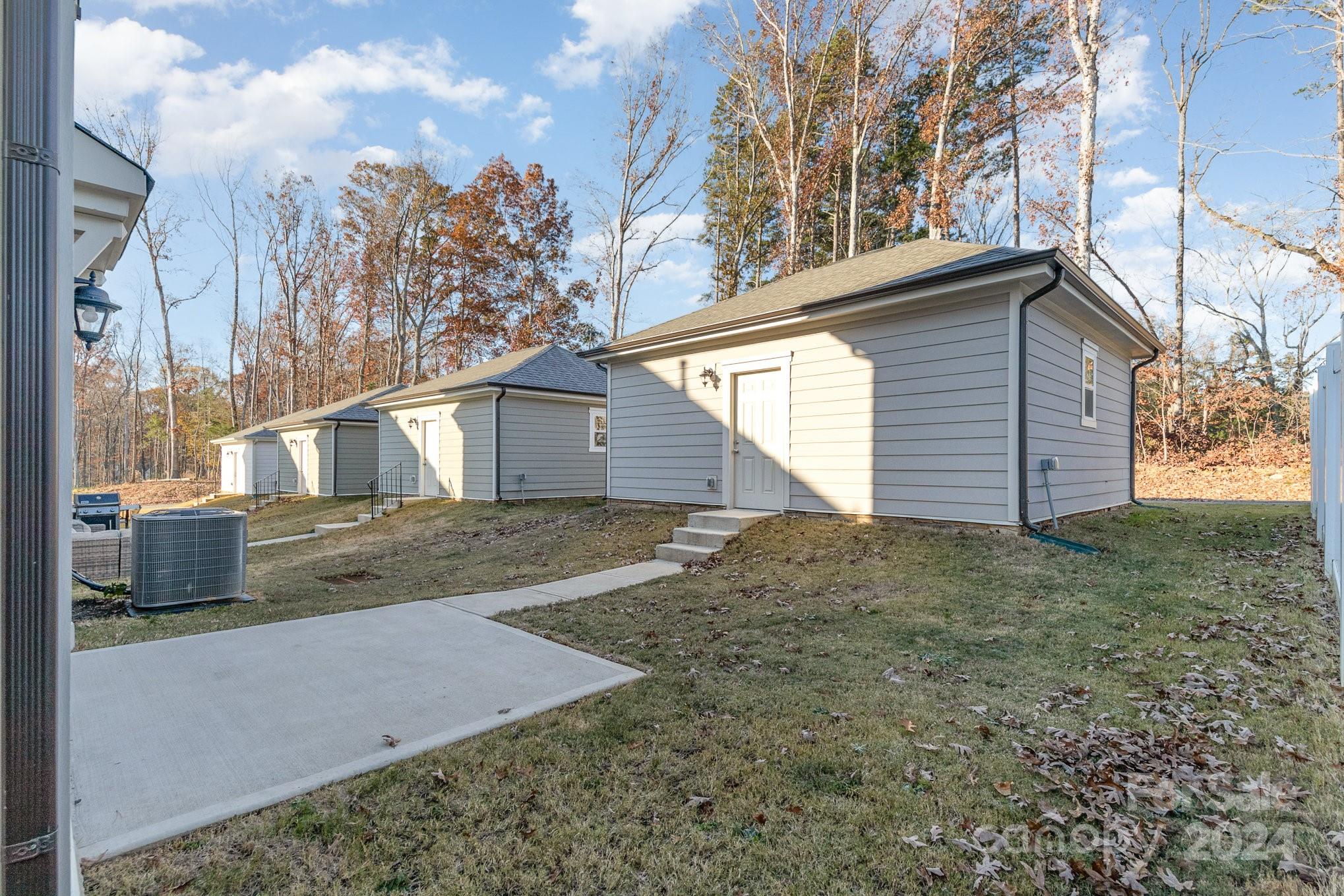 9130 Ramsford Road Charlotte, NC 28227 - Photo 17 of 18 a view of a house with a yard
