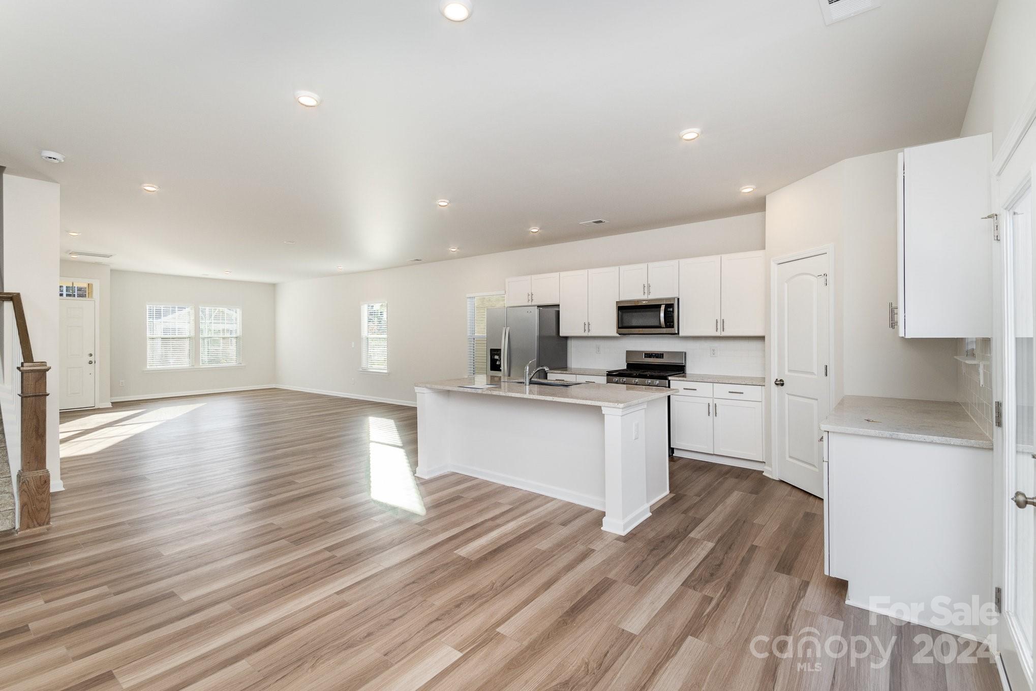 9130 Ramsford Road Charlotte, NC 28227 - Photo 6 of 18 a kitchen with white cabinets and appliances