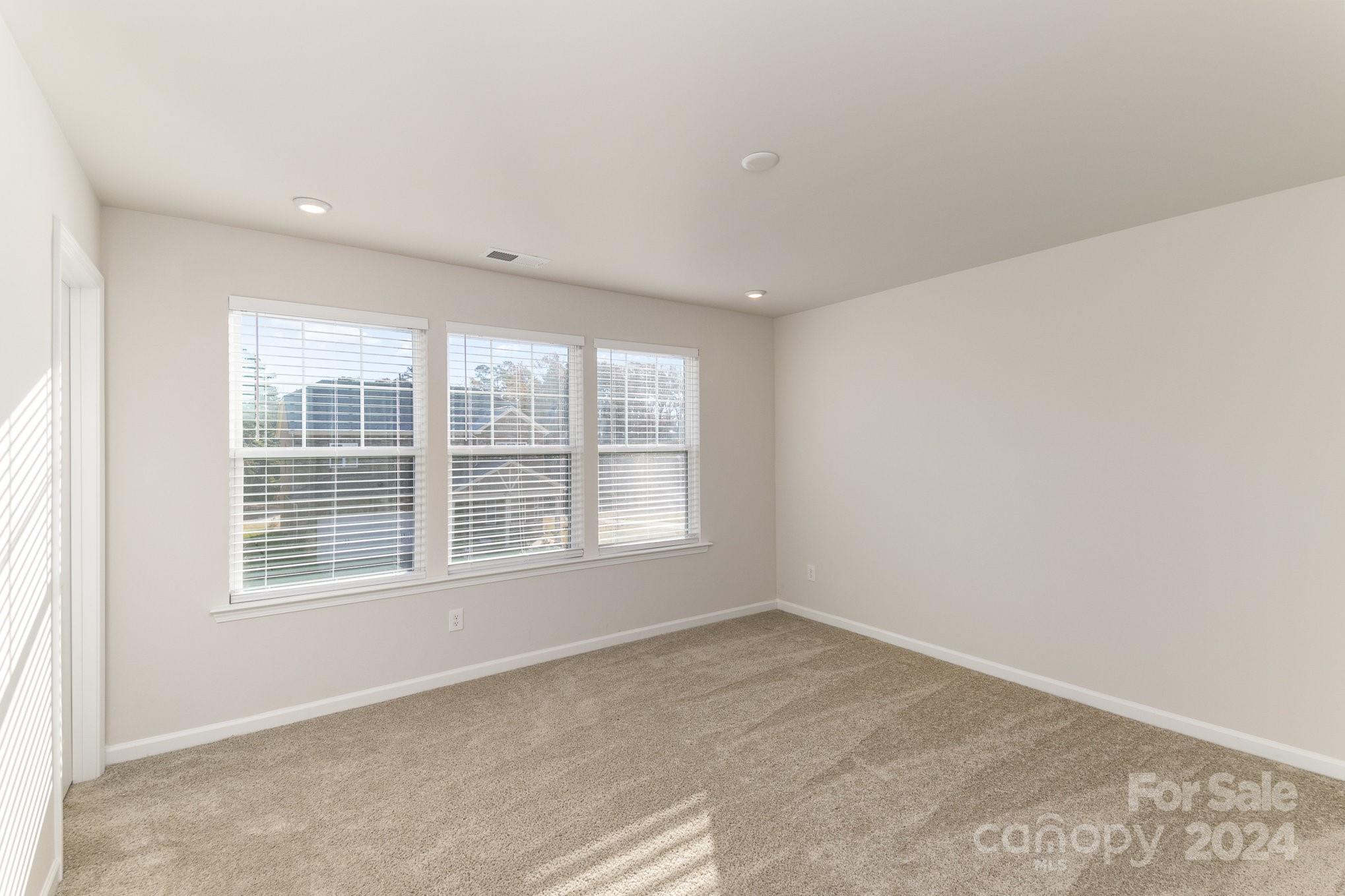 9130 Ramsford Road Charlotte, NC 28227 - Photo 9 of 18 an empty room with a window