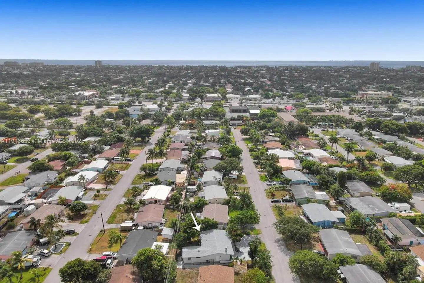 1573 Northeast 30th Court Pompano Beach, FL 33064 - Photo 12 of 27 an aerial view of residential houses with city view