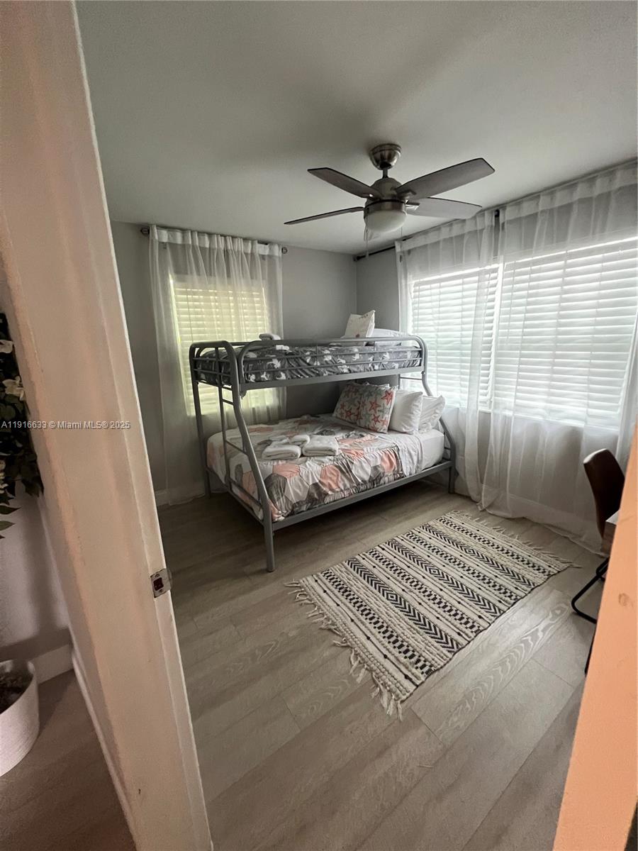 1573 Northeast 30th Court Pompano Beach, FL 33064 - Photo 20 of 27 a bedroom with furniture and a window