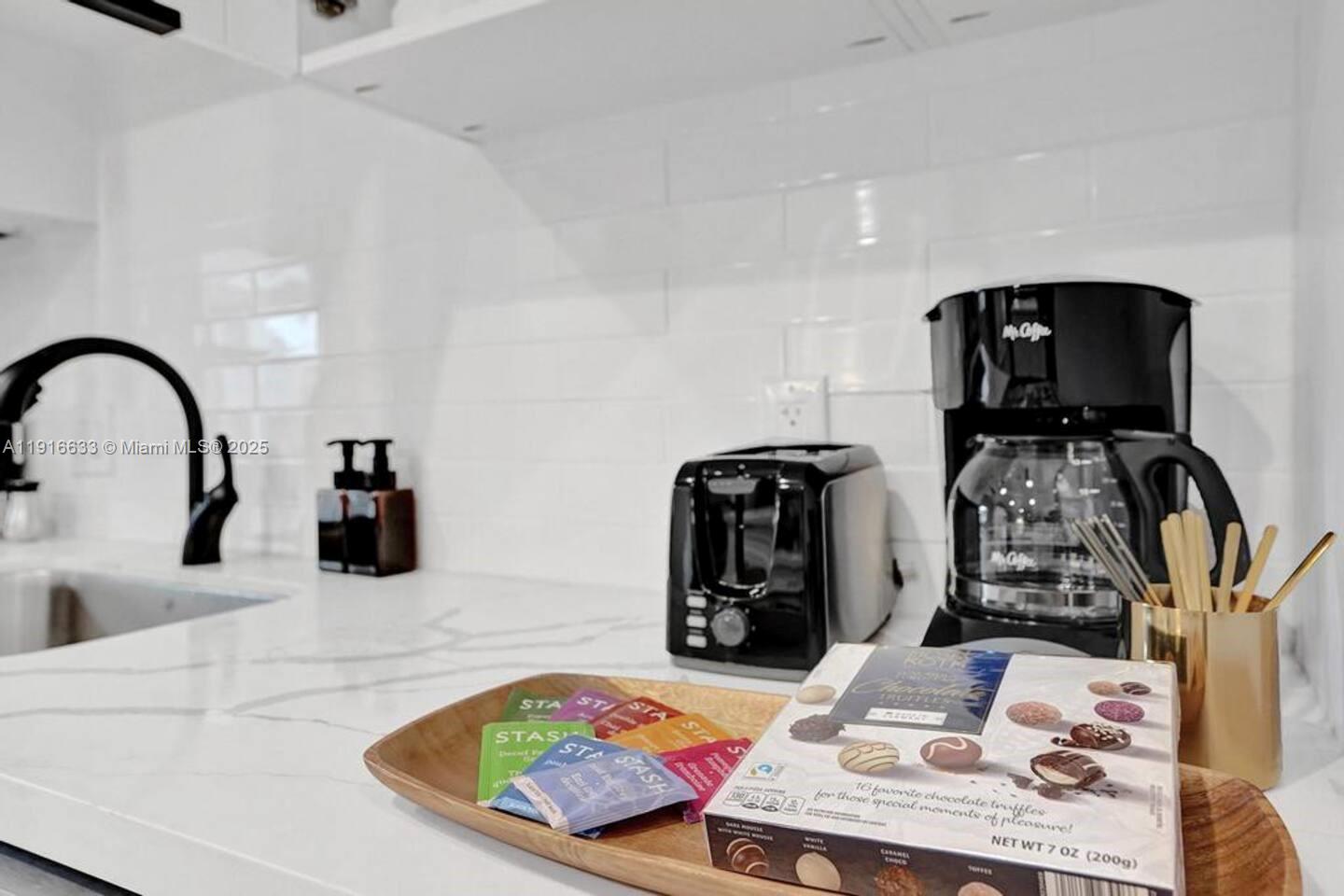 1573 Northeast 30th Court Pompano Beach, FL 33064 - Photo 5 of 27 a bathroom with a sink and a mirror