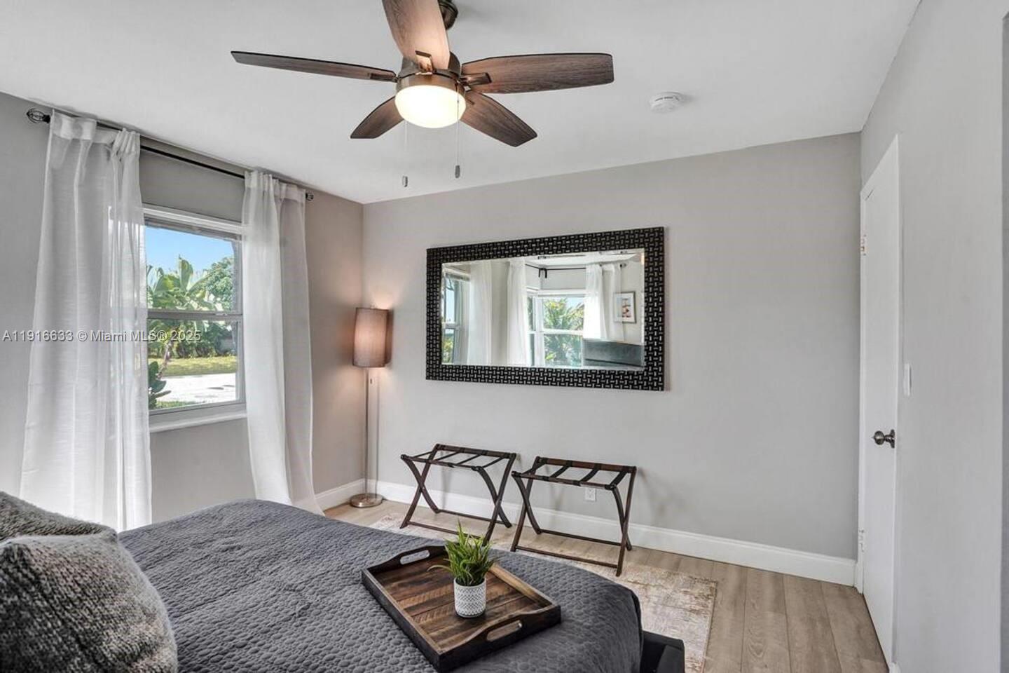 1573 Northeast 30th Court Pompano Beach, FL 33064 - Photo 6 of 27 a bedroom with furniture and a window