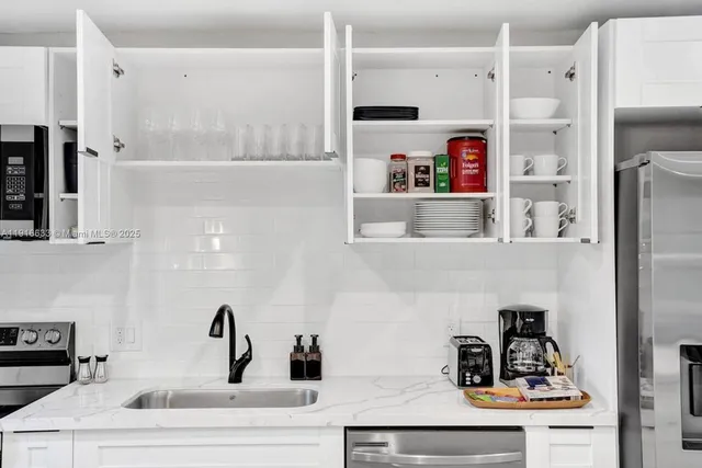 an aerial view of residential houses with city view