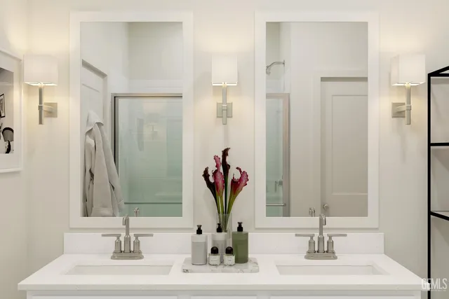 a bathroom with a glass shower door