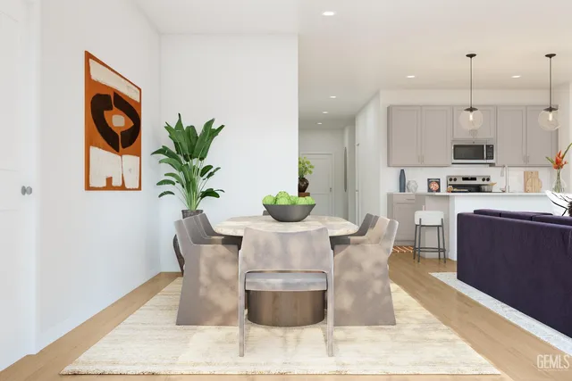 a view of a livingroom with furniture and a potted plant