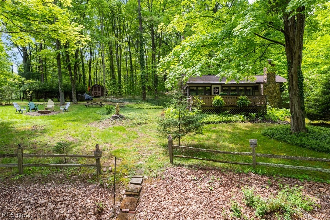 6120 Azalea Road Southwest Bowerston, OH 44695 - Photo 2 of 38 View of yard with a deck