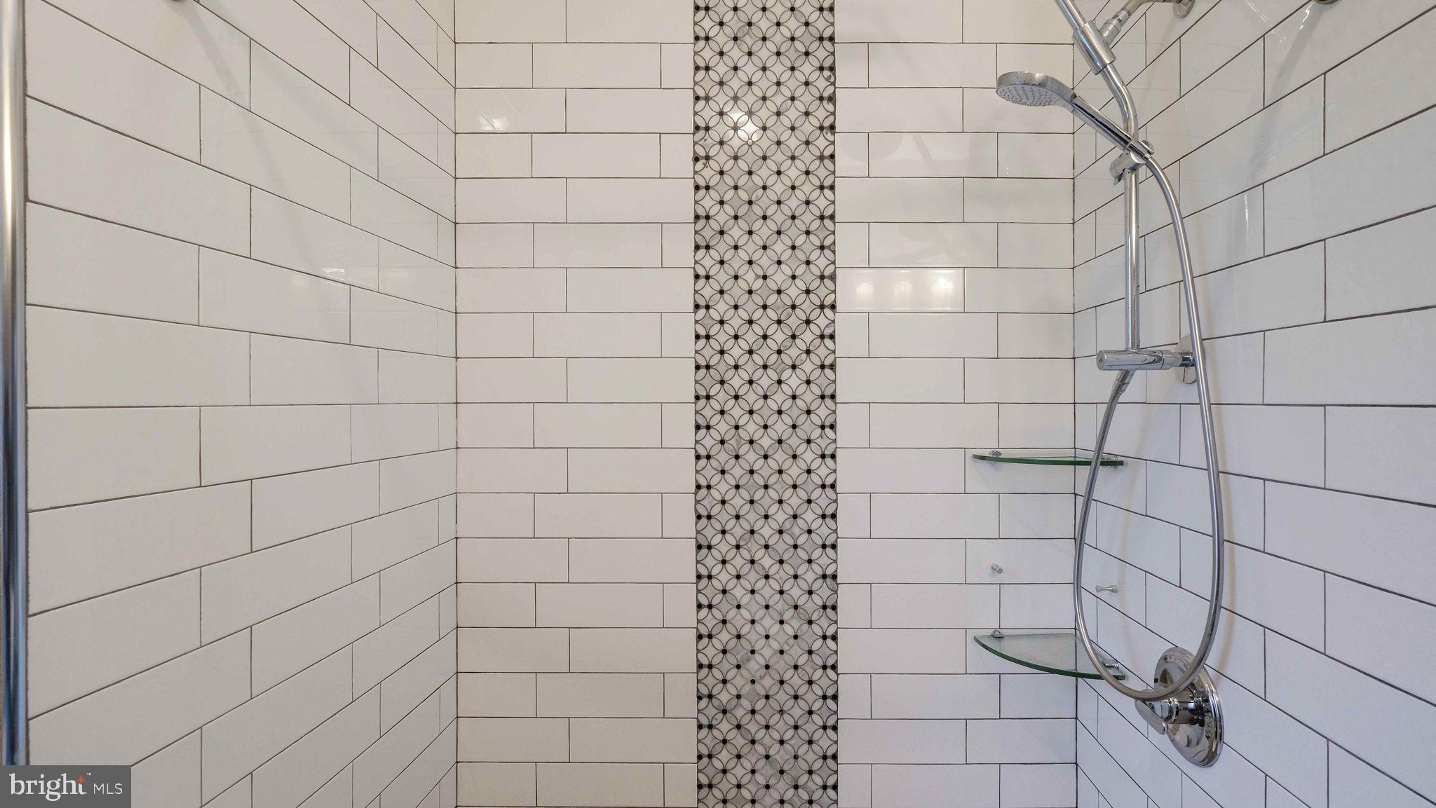 459 South Gulph Road King of Prussia, PA 19406 - Photo 23 of 43 Sleek modern shower with elegant tile design.