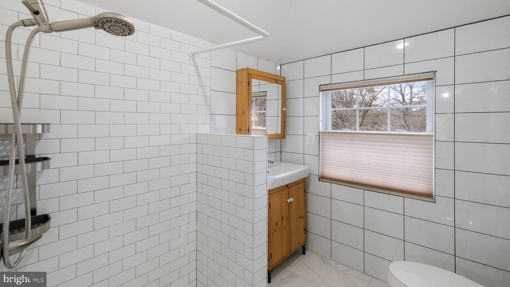 459 South Gulph Road King of Prussia, PA 19406 - Photo 28 of 43 Modern bathroom with sleek tile design.