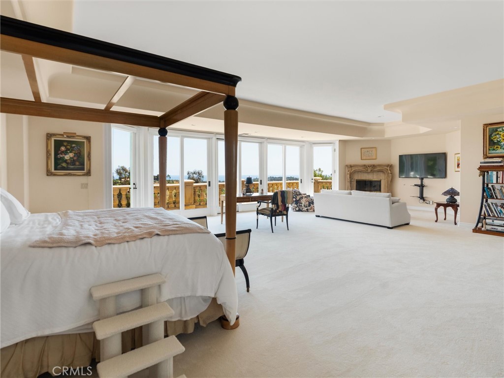 6000 Cavalleri Road Malibu, CA 90265 - Photo 27 of 44 a bedroom with furniture and large windows