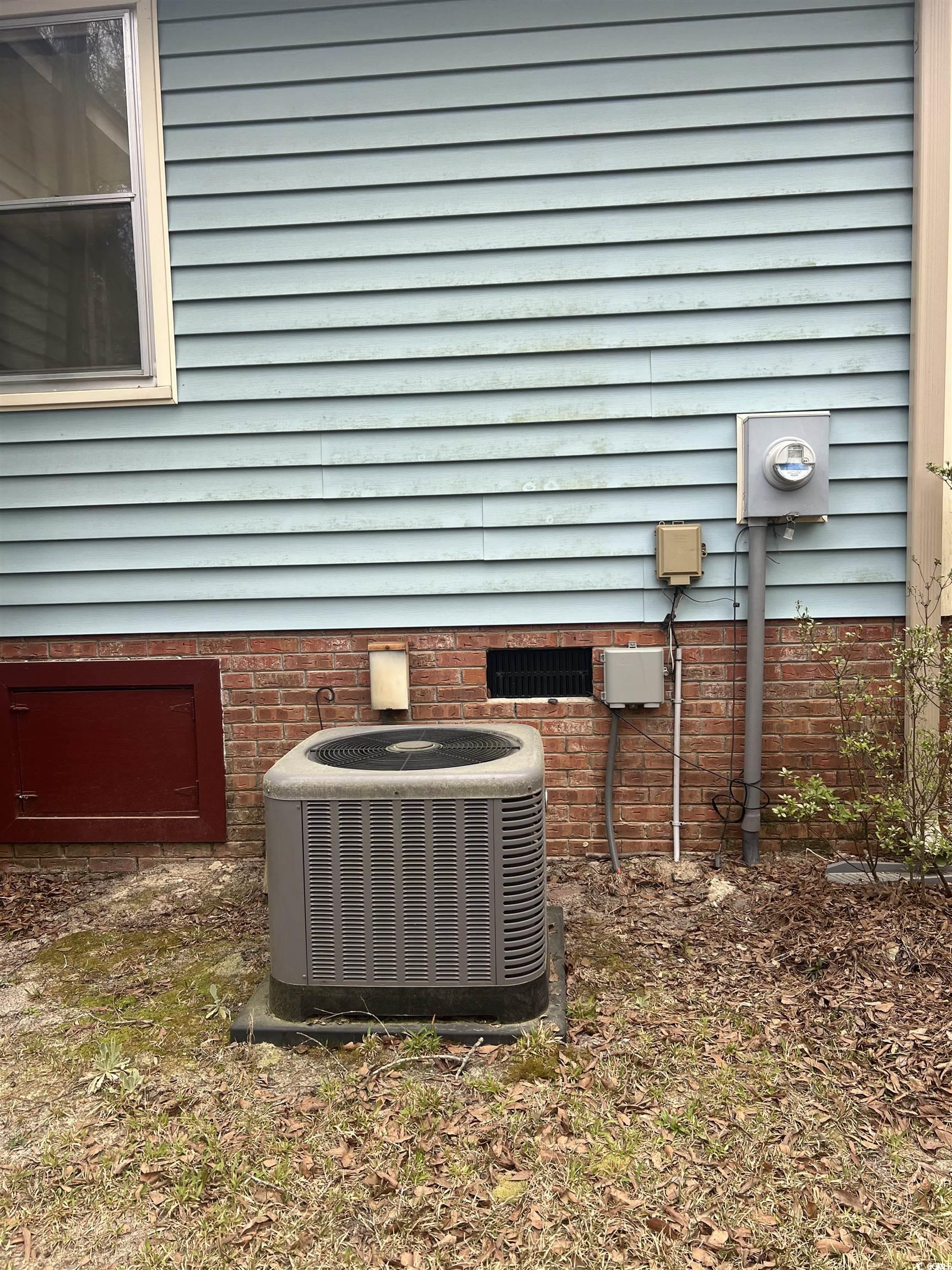 664 4 Mile Loop Cheraw, SC 29520 - Photo 23 of 27 Exterior details with electric meter and central A