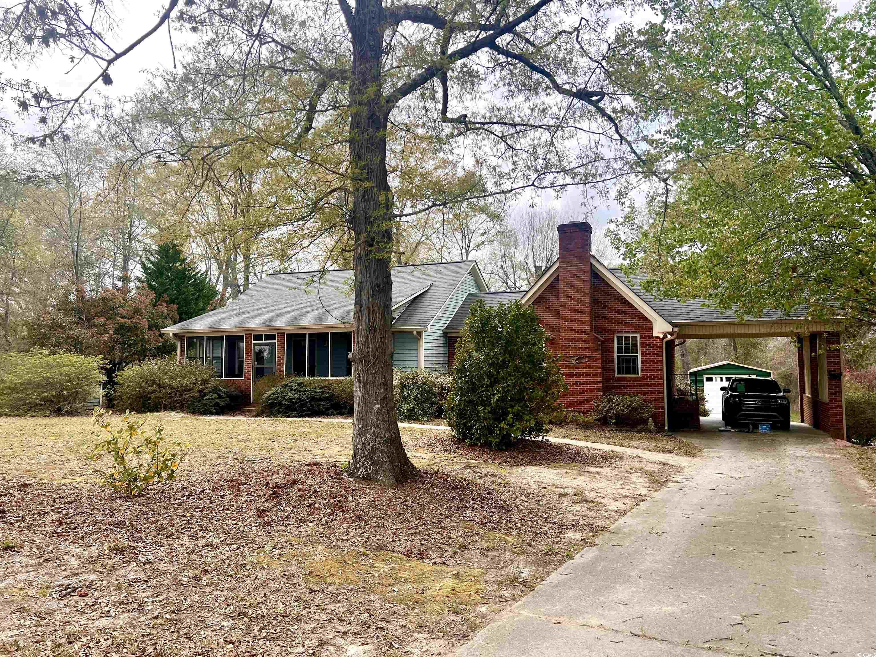 664 4 Mile Loop Cheraw, SC 29520 - Photo 25 of 27 View of front of property featuring a carport, dri