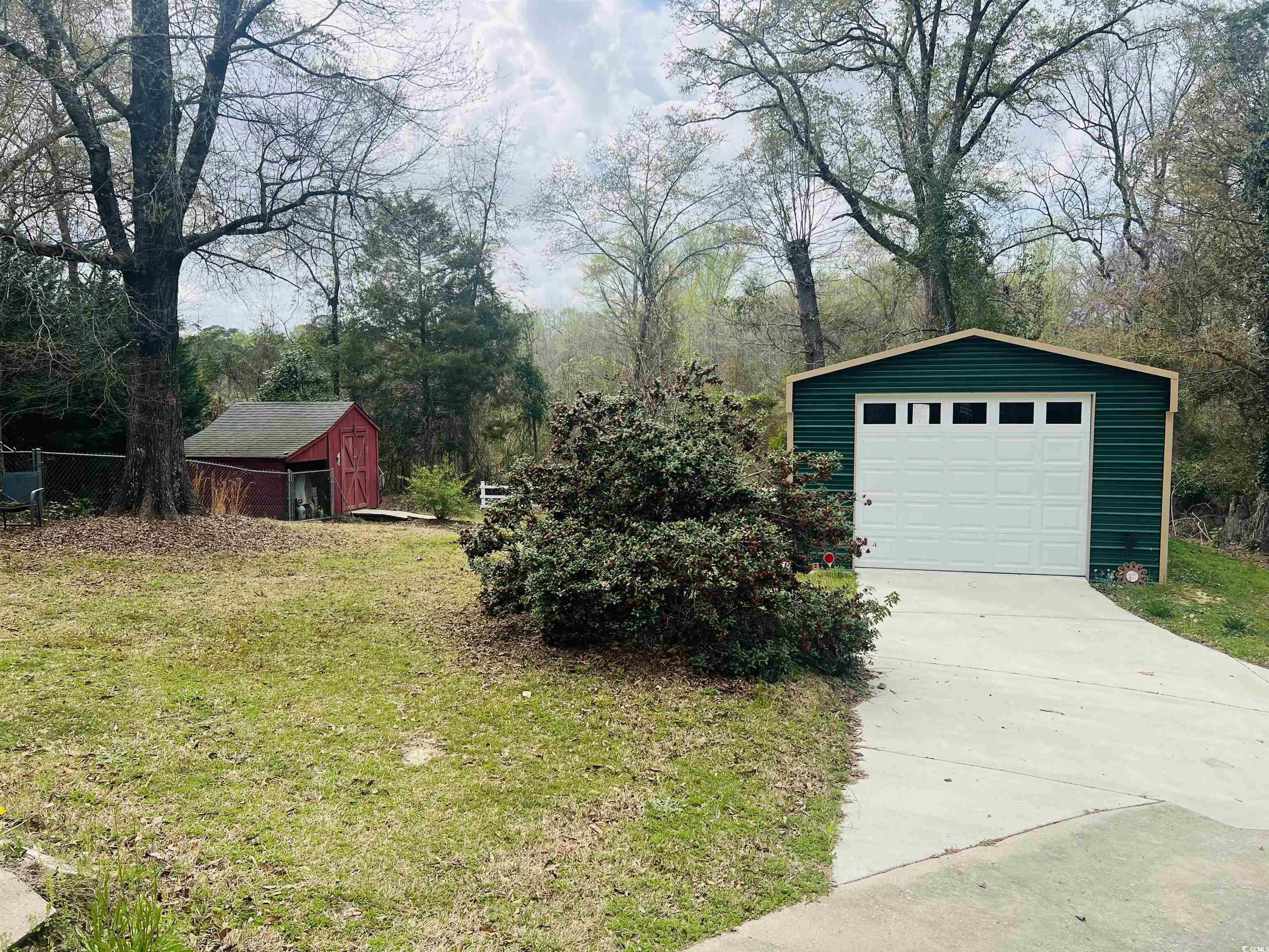 664 4 Mile Loop Cheraw, SC 29520 - Photo 7 of 27 Exterior space with driveway, an outbuilding, and