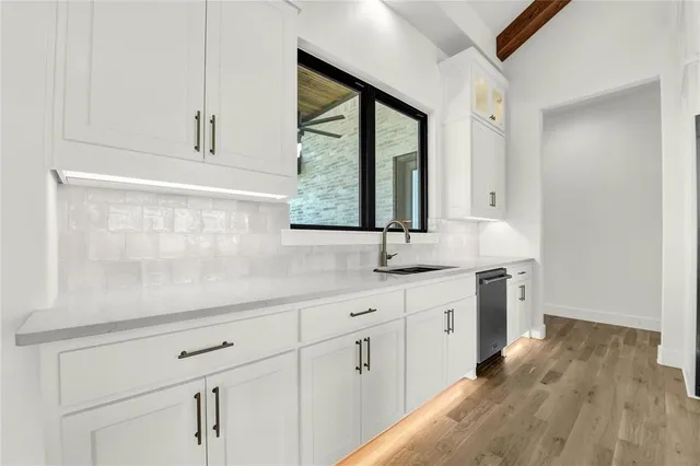 a bathroom with a double vanity sink and mirror