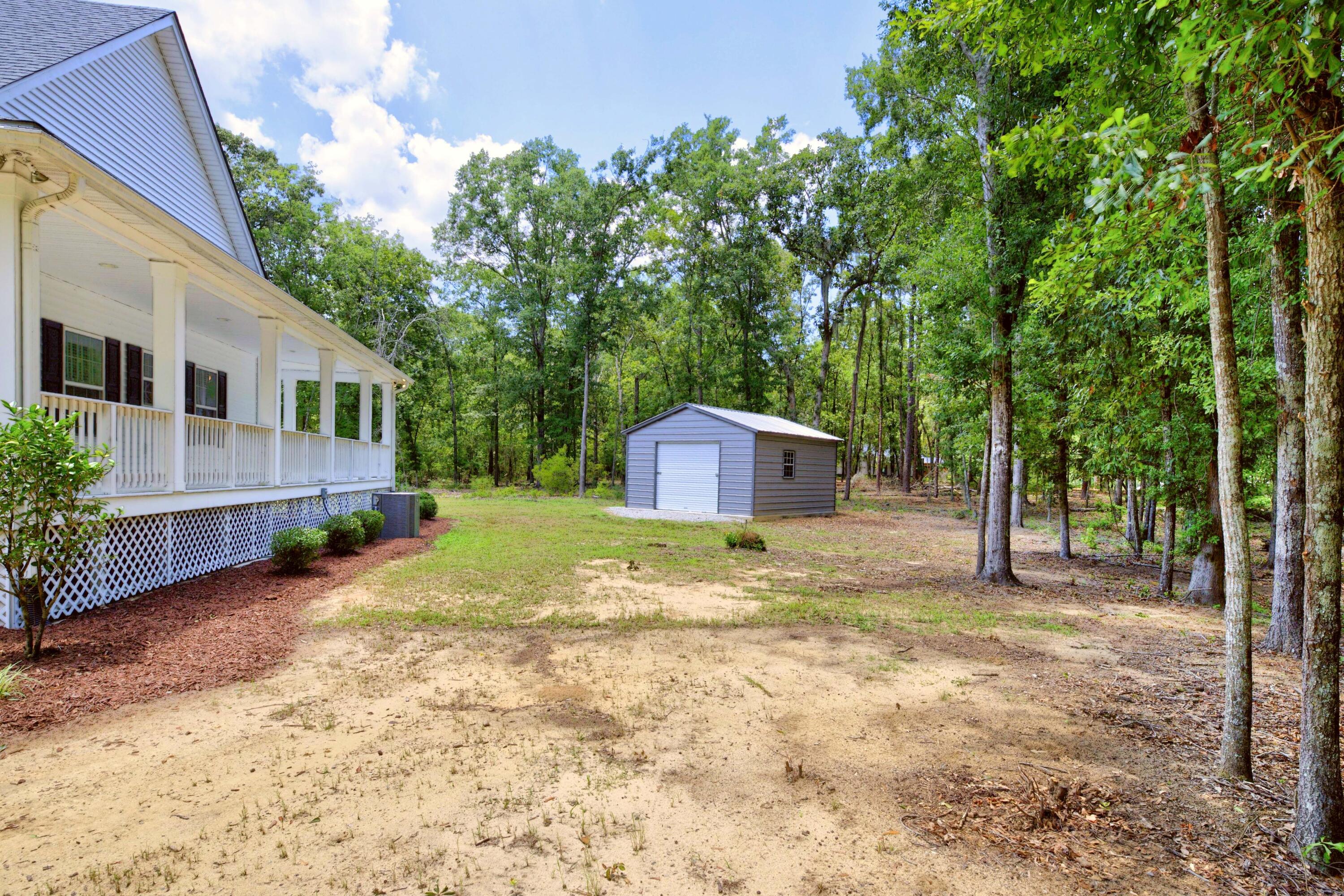 315 Griffith Lane Elloree, SC 29047 - Photo 37 of 40 Side Porch and Storage Building