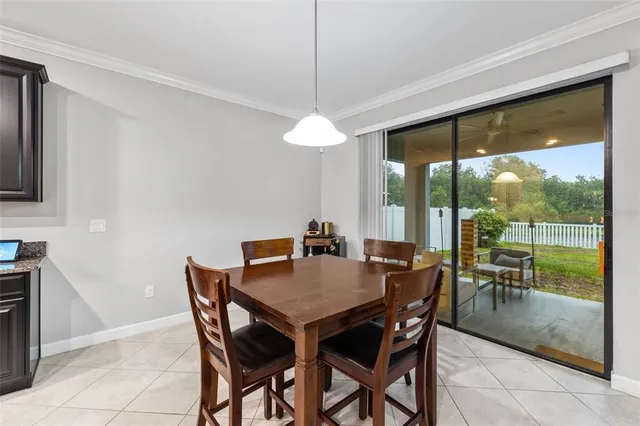 a view of a dining room with furniture wooden floor and a chandelier