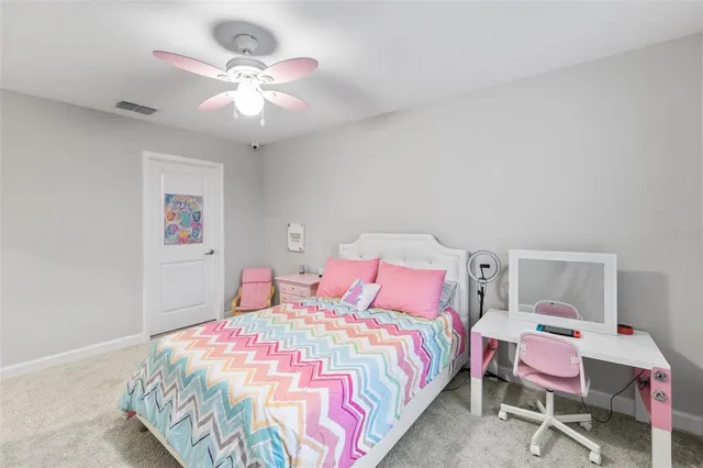 a bedroom with a bed dresser and a window