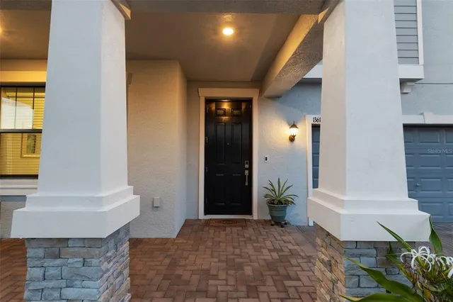 a view of entryway with a front door and wooden floor