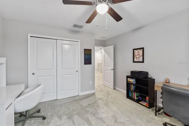 a work room with furniture and windows