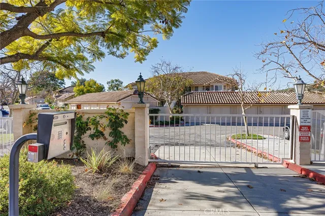 a view of a bench in front of a house