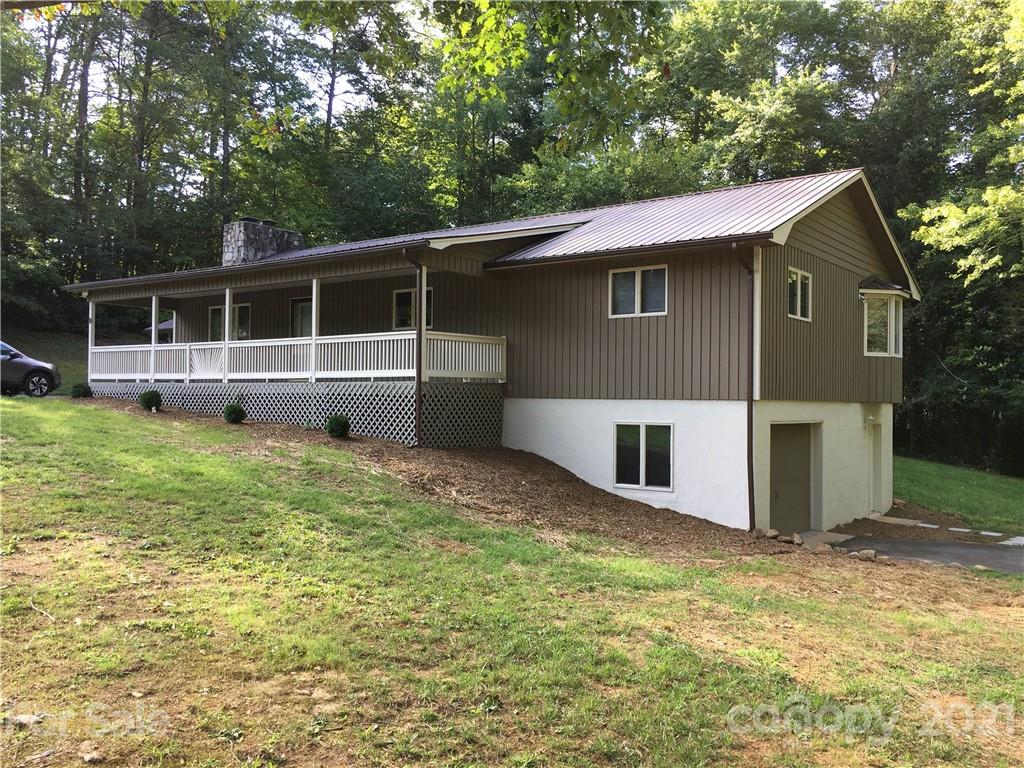 21 Sitton Road Sylva, NC 28779 - Photo 2 of 16 a view of a house with a yard