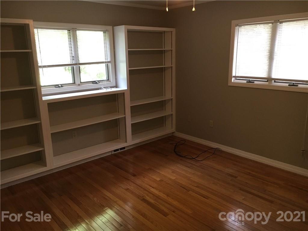 21 Sitton Road Sylva, NC 28779 - Photo 11 of 16 a view of an empty room with a window and wooden floor