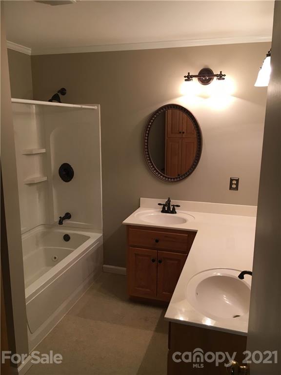 21 Sitton Road Sylva, NC 28779 - Photo 13 of 16 a bathroom with a sink and a mirror