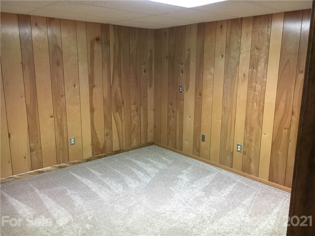 21 Sitton Road Sylva, NC 28779 - Photo 15 of 16 a view of an empty room with wooden walls