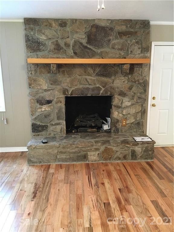 21 Sitton Road Sylva, NC 28779 - Photo 8 of 16 a view of fireplace and wooden floor