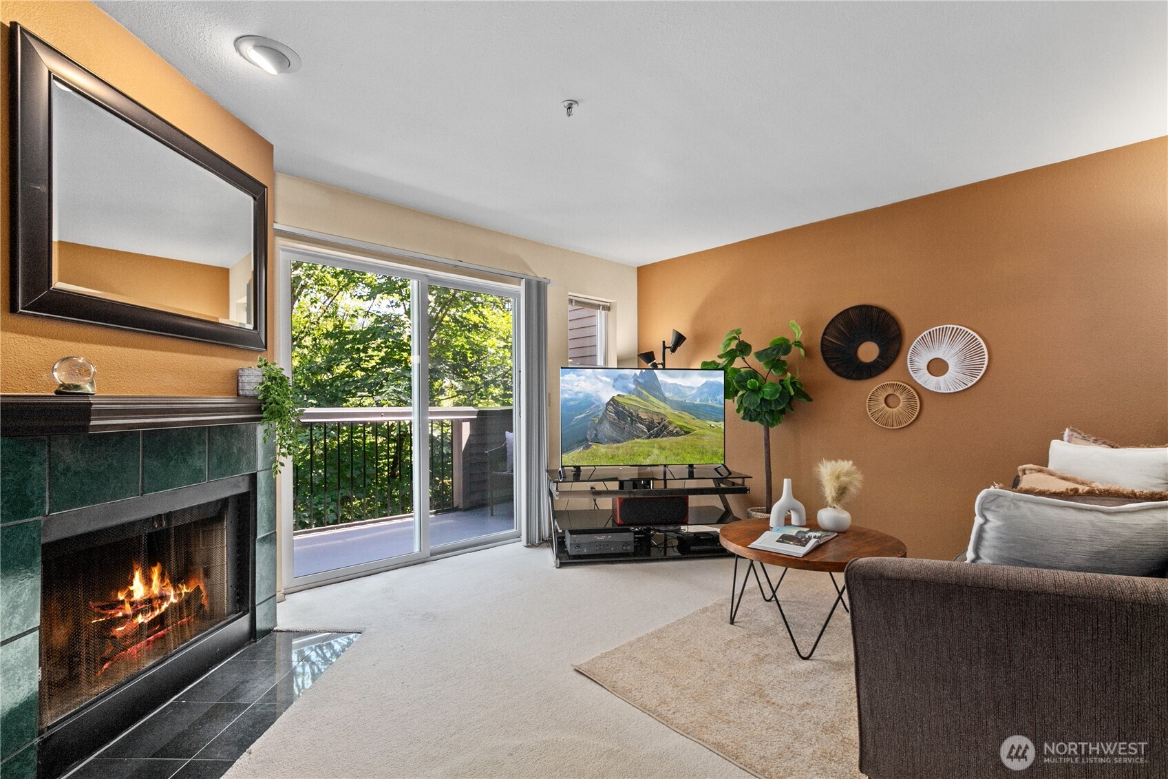 16019 Waynita Way Northeast, Unit F207 Bothell, WA 98011 - Photo 12 of 39 a living room with furniture and a fireplace