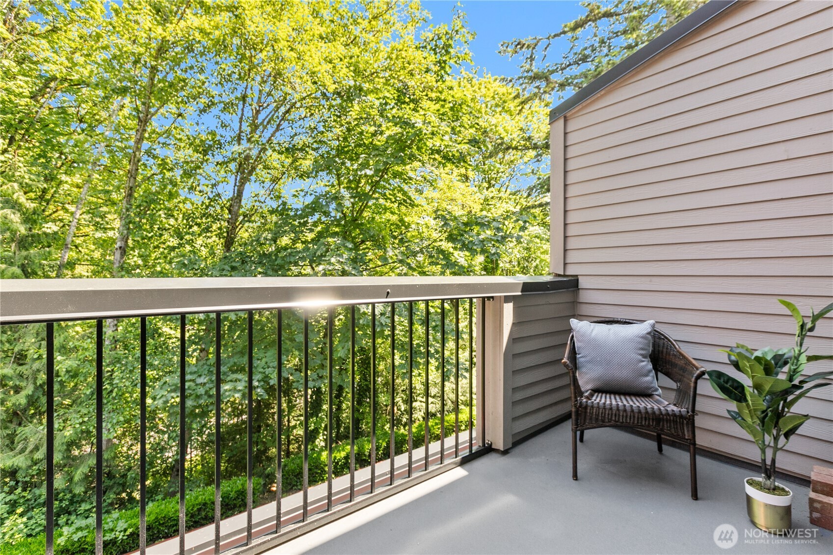 16019 Waynita Way Northeast, Unit F207 Bothell, WA 98011 - Photo 13 of 39 a view of a chair in wooden deck