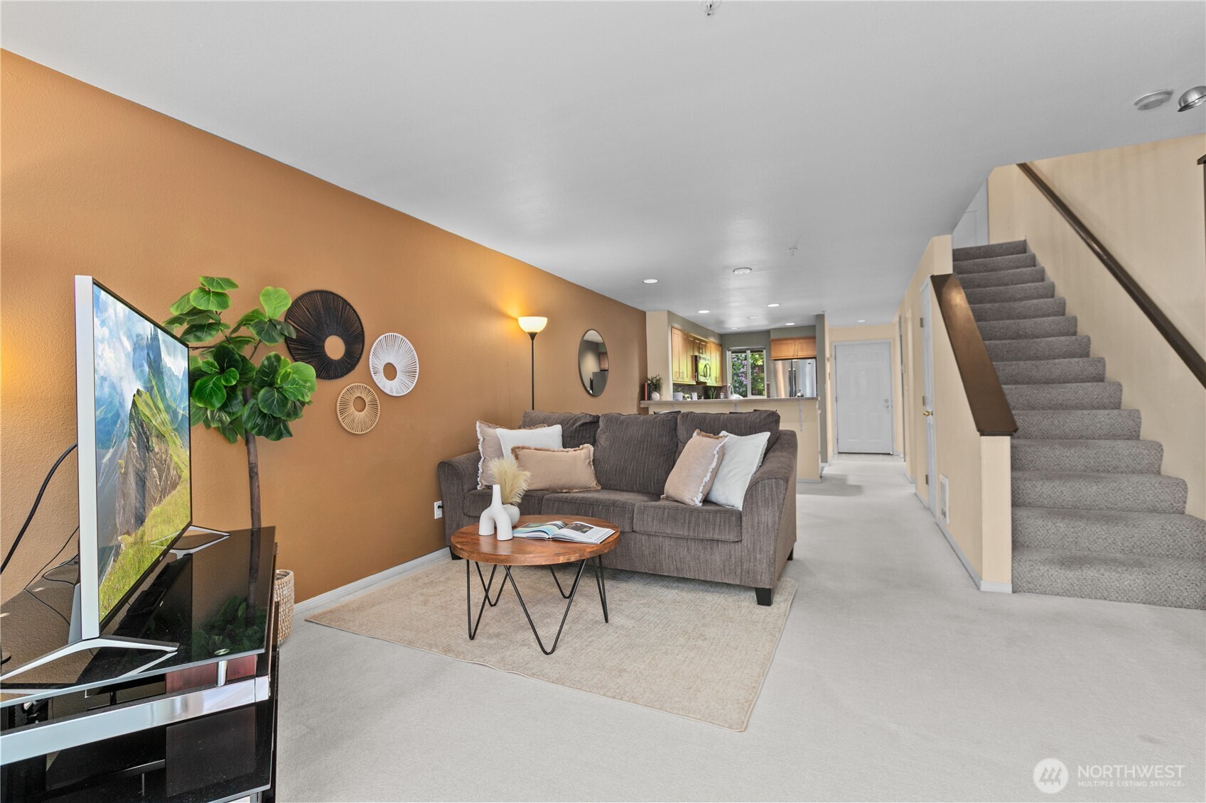 16019 Waynita Way Northeast, Unit F207 Bothell, WA 98011 - Photo 15 of 39 a living room with furniture and a potted plant