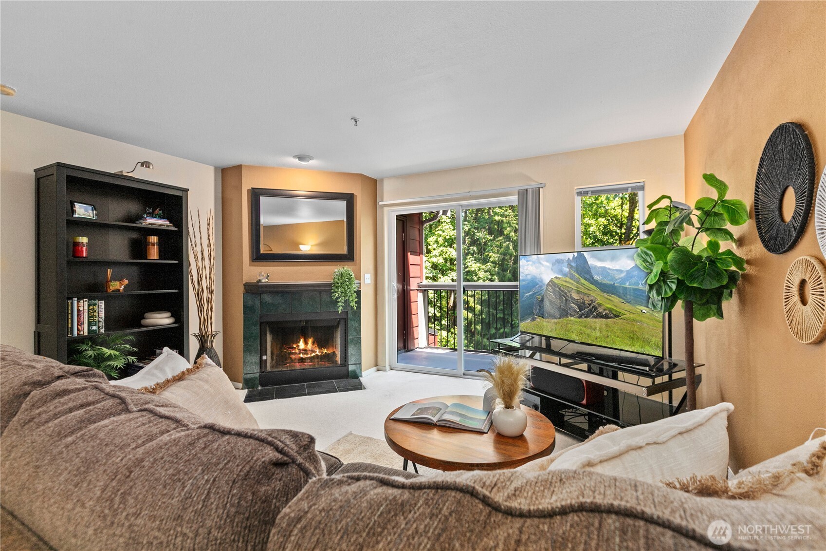 16019 Waynita Way Northeast, Unit F207 Bothell, WA 98011 - Photo 2 of 39 a living room with furniture a fireplace and a potted plant