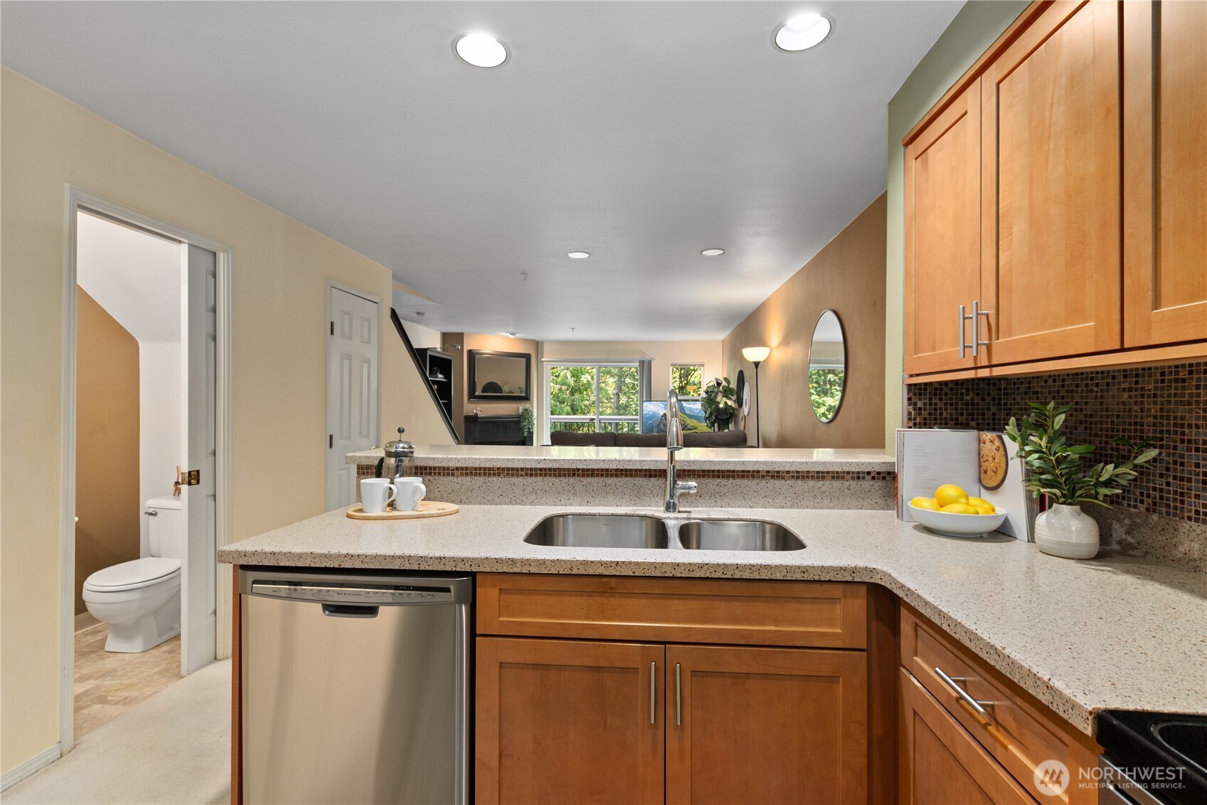 16019 Waynita Way Northeast, Unit F207 Bothell, WA 98011 - Photo 5 of 39 a kitchen with a sink a counter space and appliances