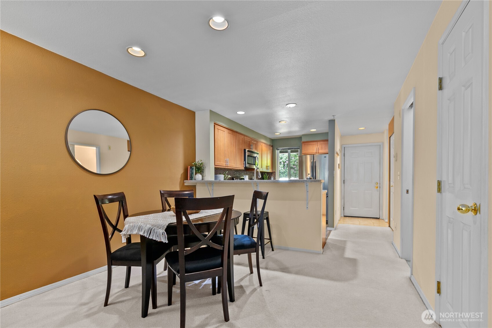 16019 Waynita Way Northeast, Unit F207 Bothell, WA 98011 - Photo 9 of 39 a dining room with furniture and a mirror