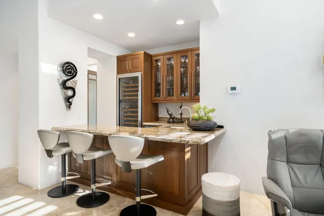 a kitchen with a table and chairs