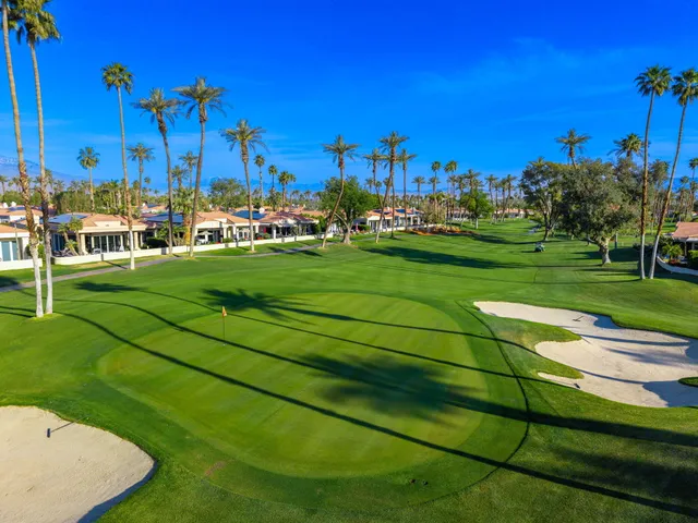 a view of a golf course with a house