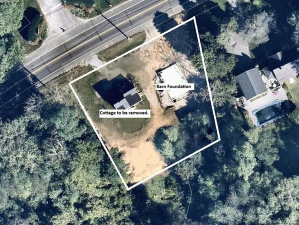 an aerial view of residential house with outdoor space