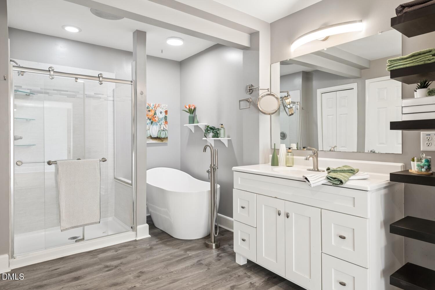 414 South Maple Street Graham, NC 27253 - Photo 15 of 42 a spacious bathroom with a double vanity sink mirror and shower