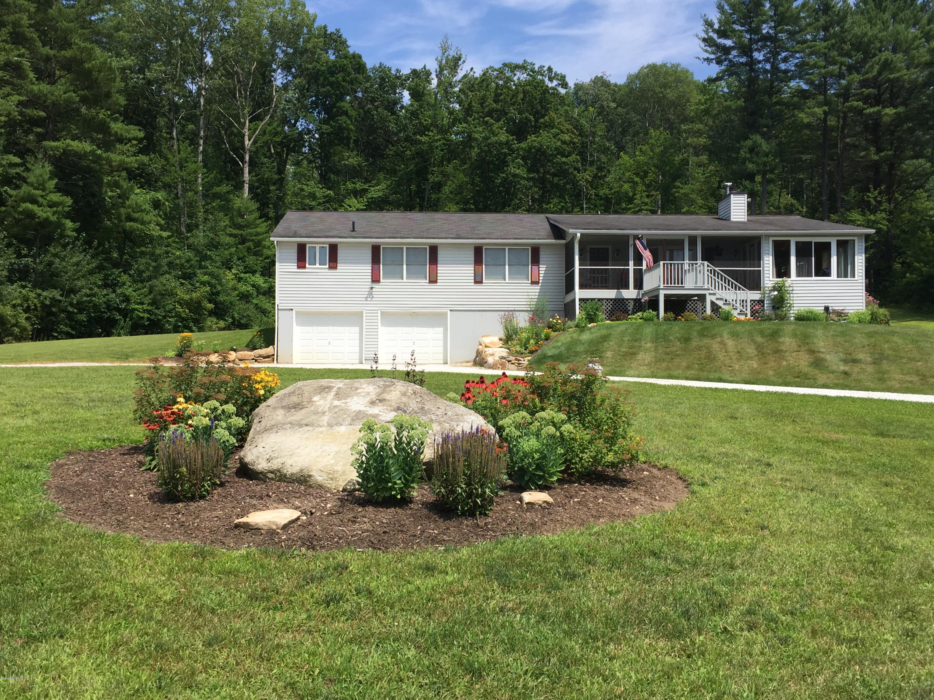 181 Bunce Road South Sheffield, MA 01222 - Photo 1 of 22 a front view of a house with a garden