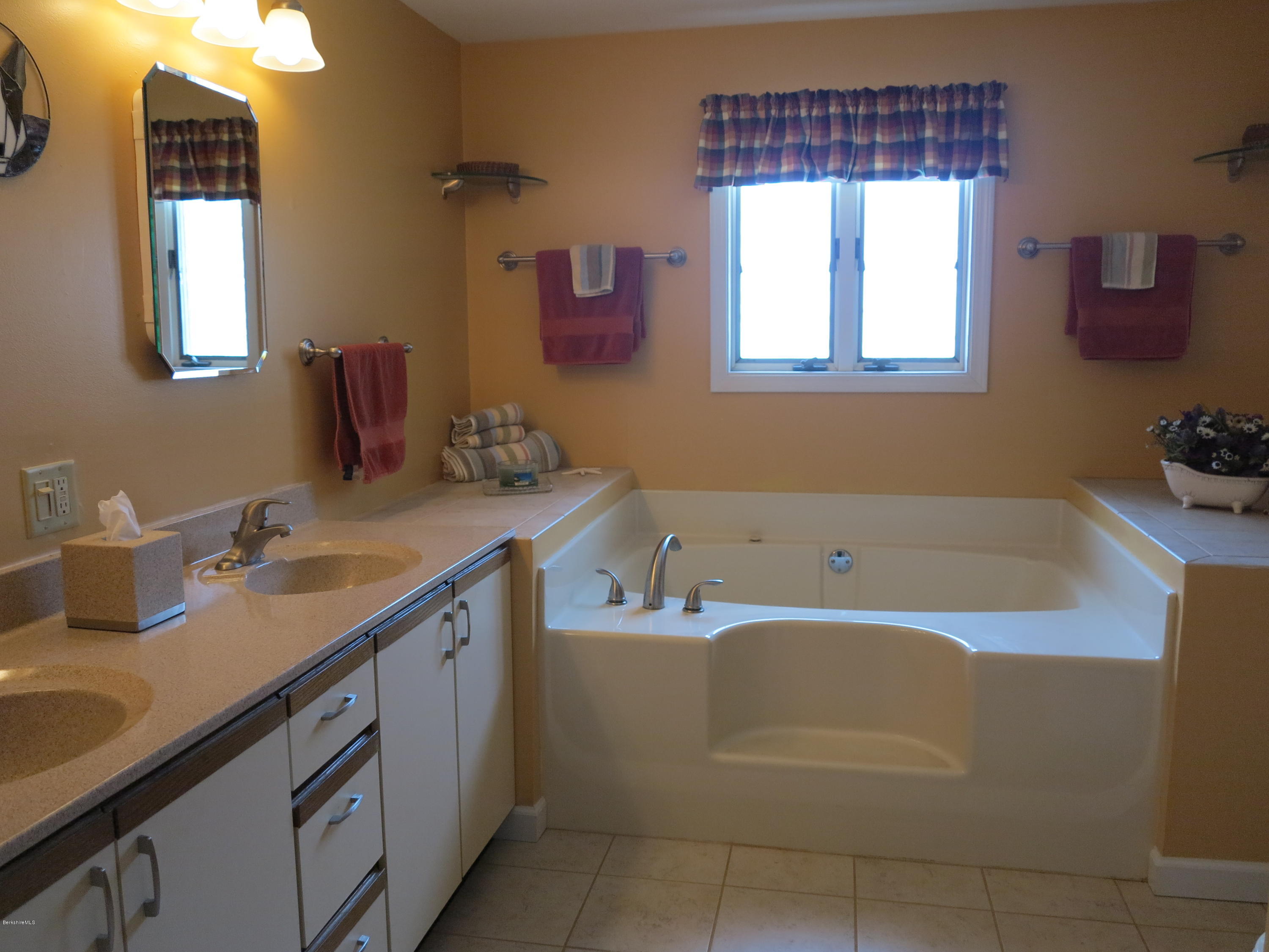 181 Bunce Road South Sheffield, MA 01222 - Photo 11 of 22 a bathroom with a tub sink and mirror