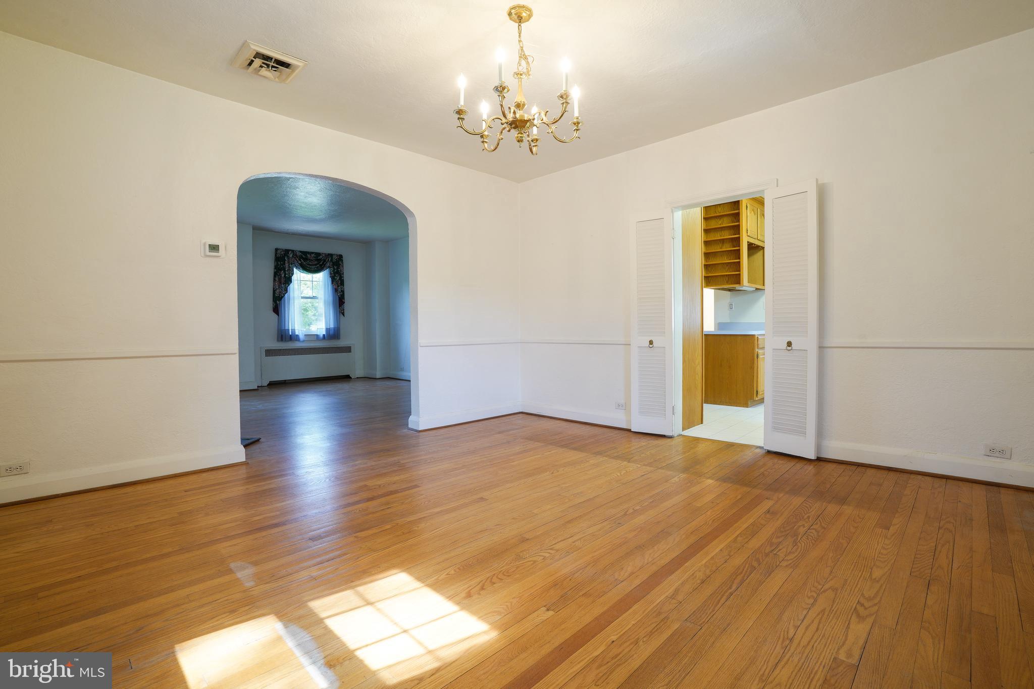 6339 Frederick Road Baltimore, MD 21228 - Photo 11 of 33 Original hardwood floors throughout the hone
