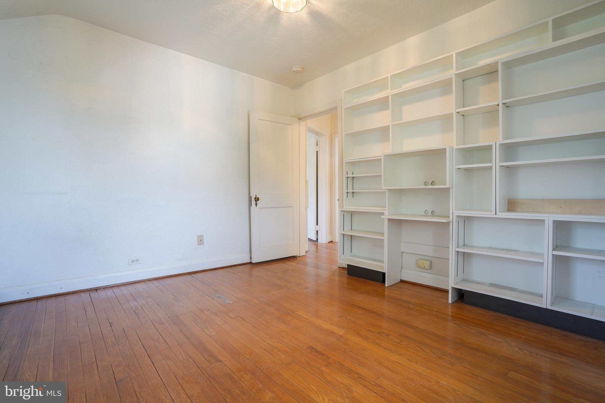 6339 Frederick Road Baltimore, MD 21228 - Photo 23 of 33 3rd bedroom. Shelving conveys