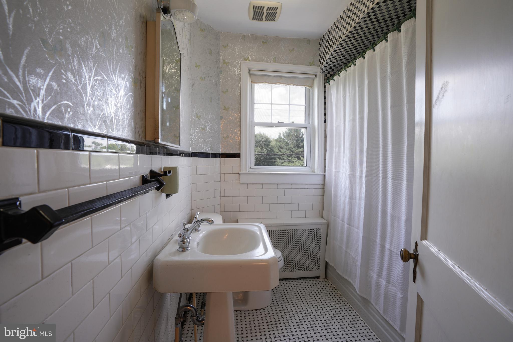 6339 Frederick Road Baltimore, MD 21228 - Photo 24 of 33 Vintage black & white tile in full bathroom