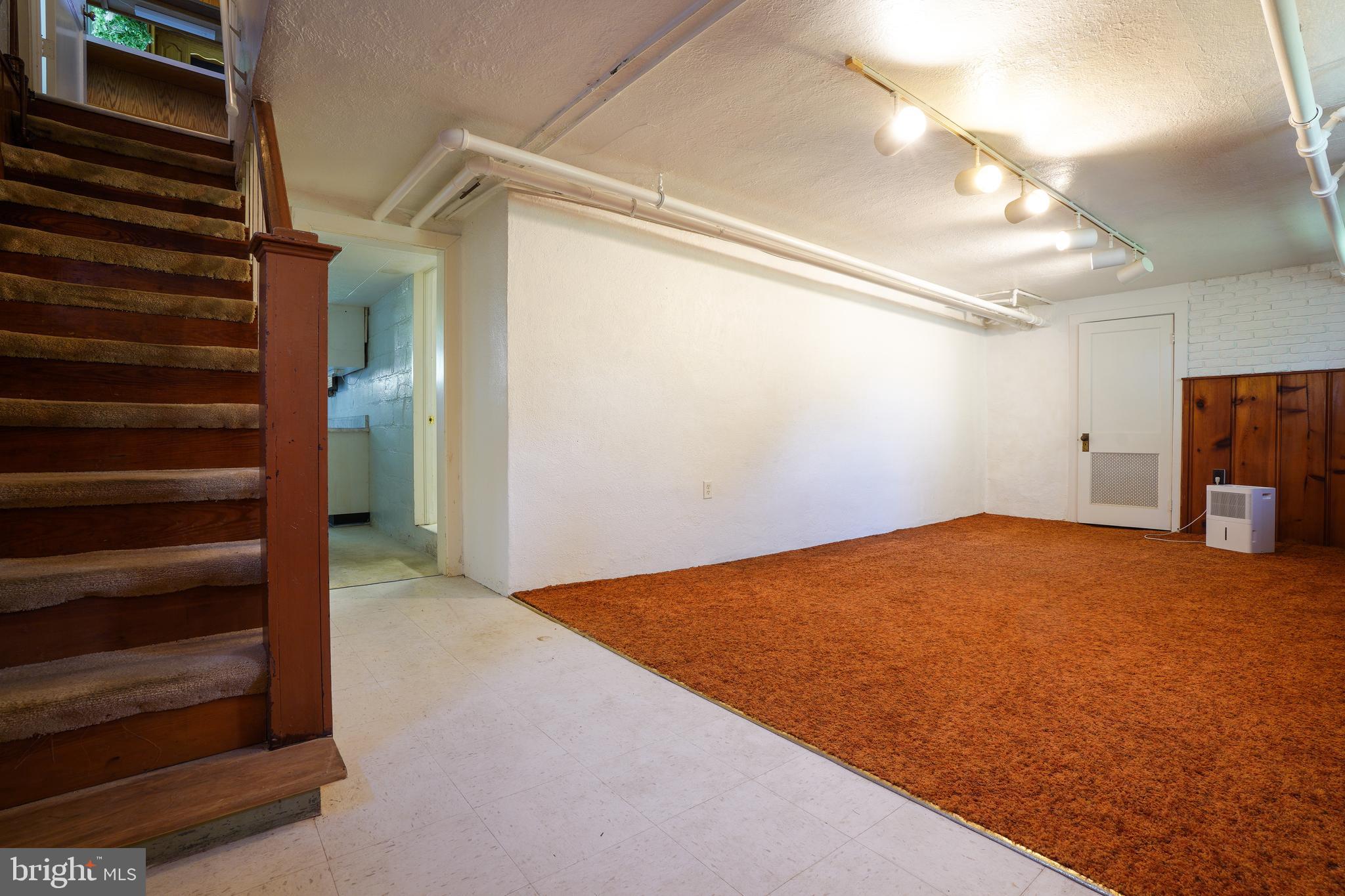 6339 Frederick Road Baltimore, MD 21228 - Photo 25 of 33 Finished lower level. Toilet & sink on this level.