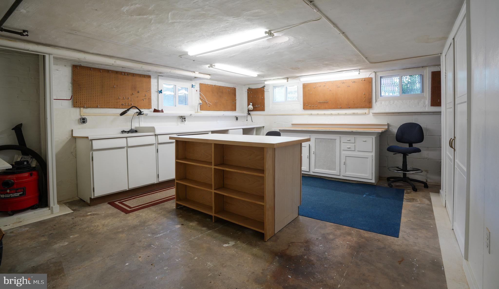 6339 Frederick Road Baltimore, MD 21228 - Photo 28 of 33 Workshop w cabinet & closet storage