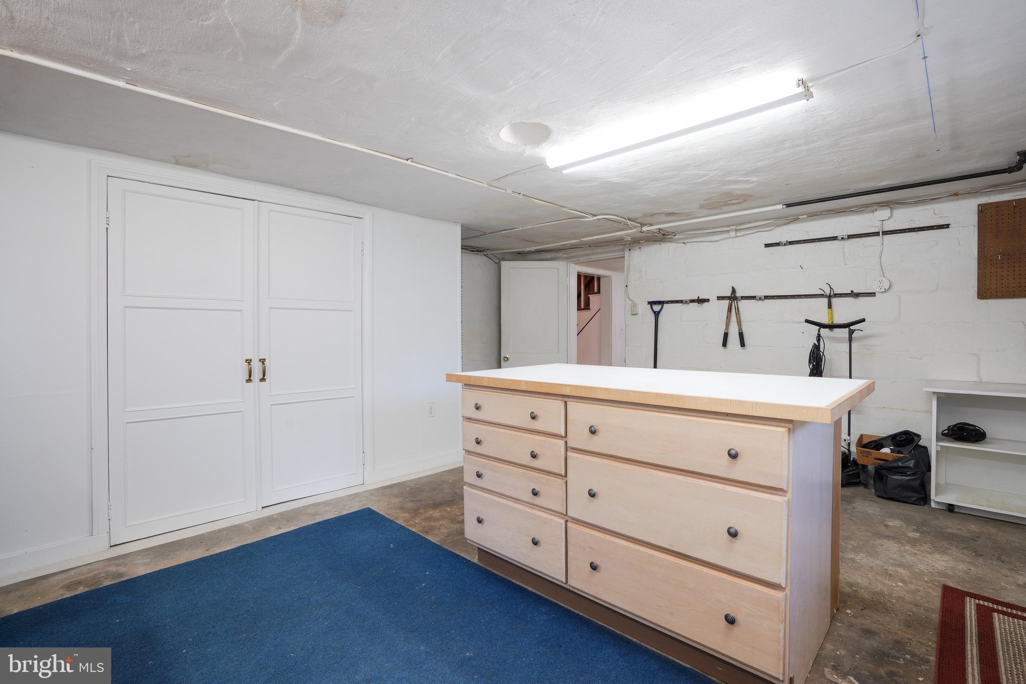 6339 Frederick Road Baltimore, MD 21228 - Photo 29 of 33 Workbench & storage closet