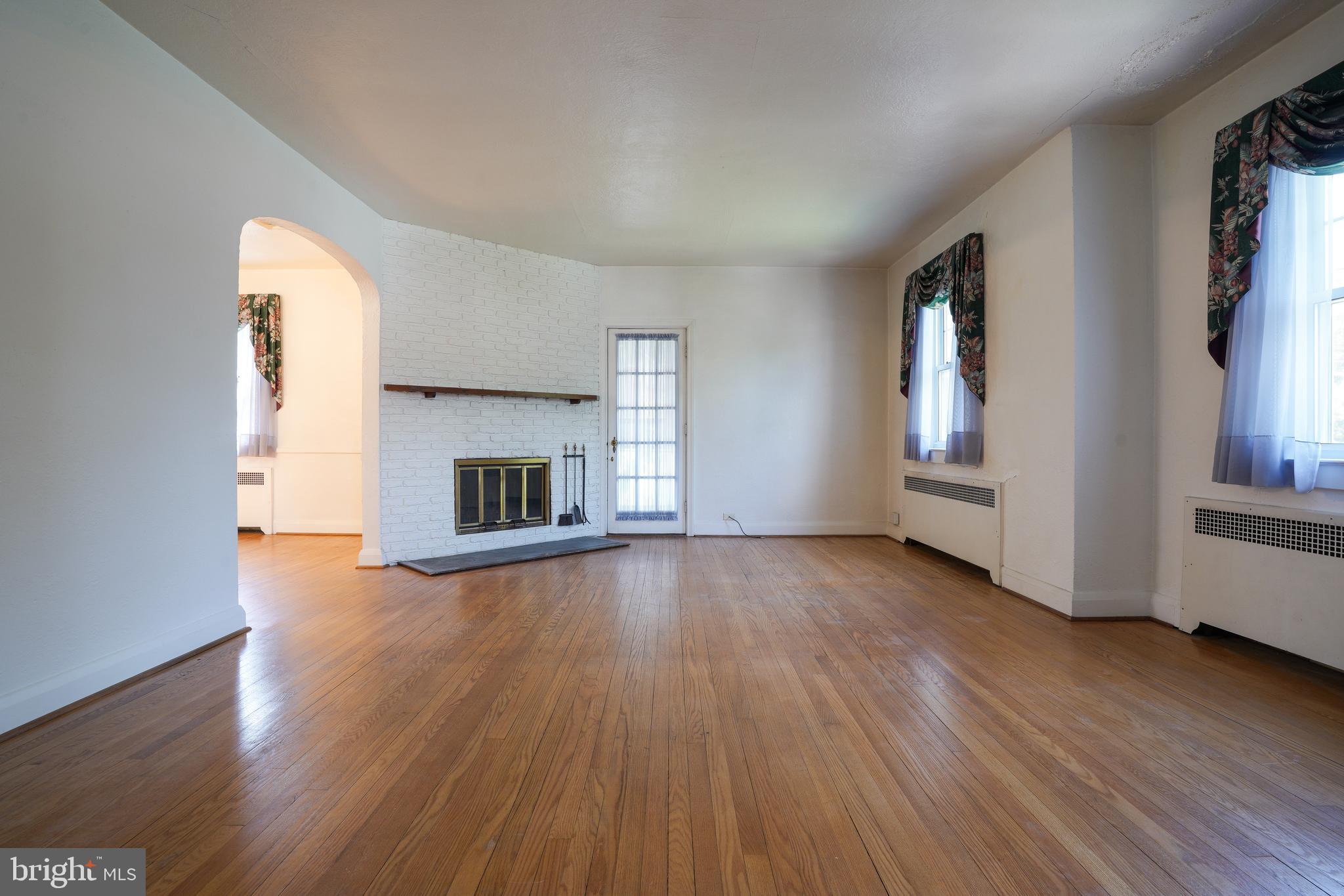 6339 Frederick Road Baltimore, MD 21228 - Photo 7 of 33 Huge living rm w gorgeous wood flrs & fireplace